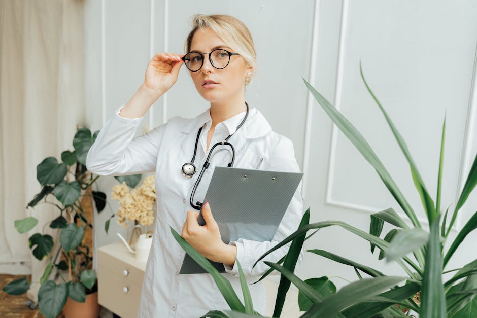 confident-female-doctor-wearing-eyeglasses-and-holding-a-cli