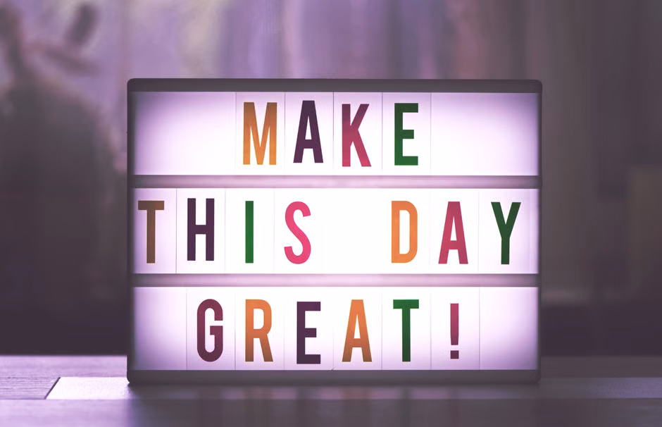 Inspirational sign displaying 'Make This Day Great' in colorful letters.